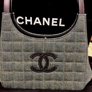 Genuine Chanel Vintage purse. Distressed Denim with leather straps and logo